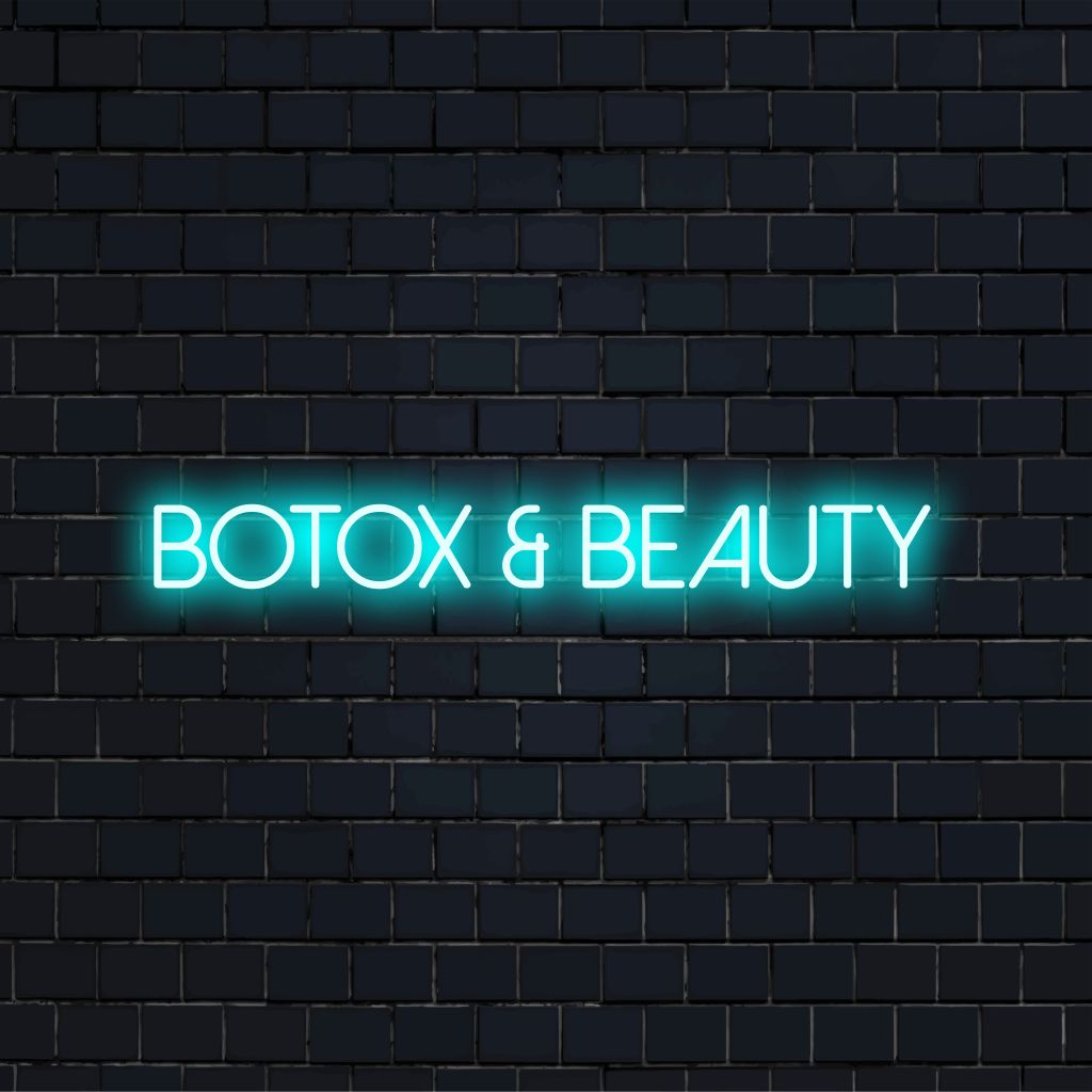 Botox Beauty LED Neon Sign, bright neon lettering against black brick wall