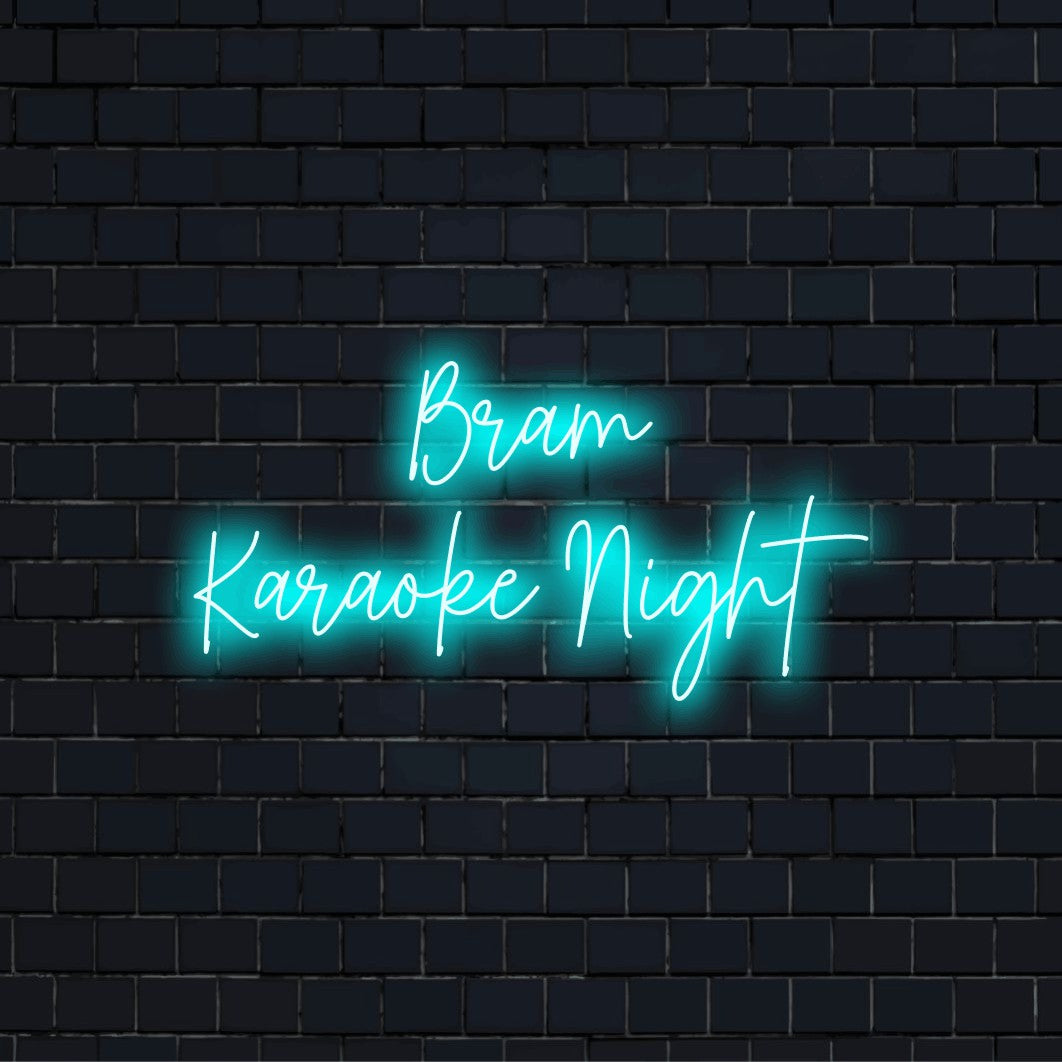 Bram Karaoke Night Custom Name Neon Sign, glowing lettering against black brick wall