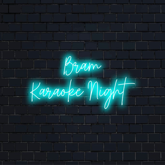 Bram Karaoke Night Custom Name Neon Sign, glowing lettering against black brick wall