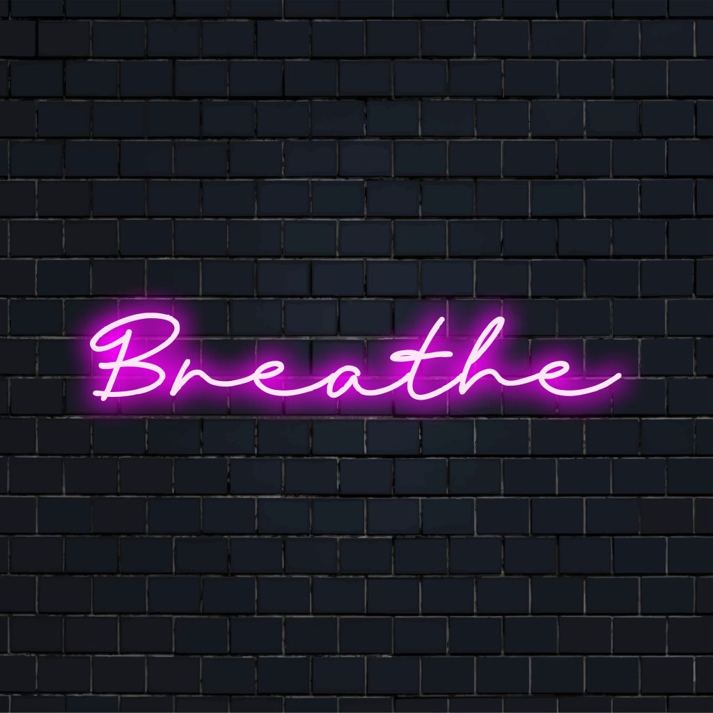 Breathe Neon Light with bright neon glow on dark brick wall