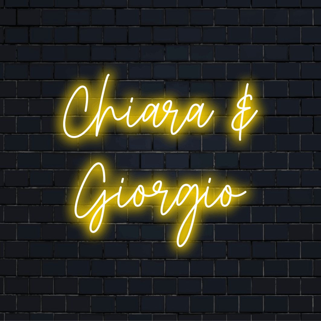 Chiara _ Giorgio Custom Name Neon Sign, glowing lettering on dark brick wall