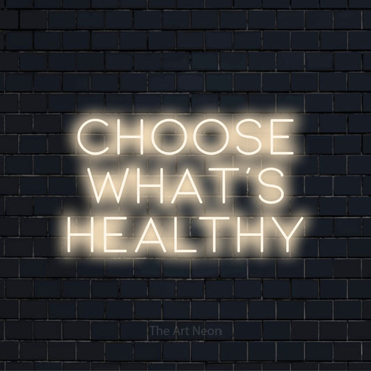 "Choose What’s Healthy" neon text design on a black brick wall