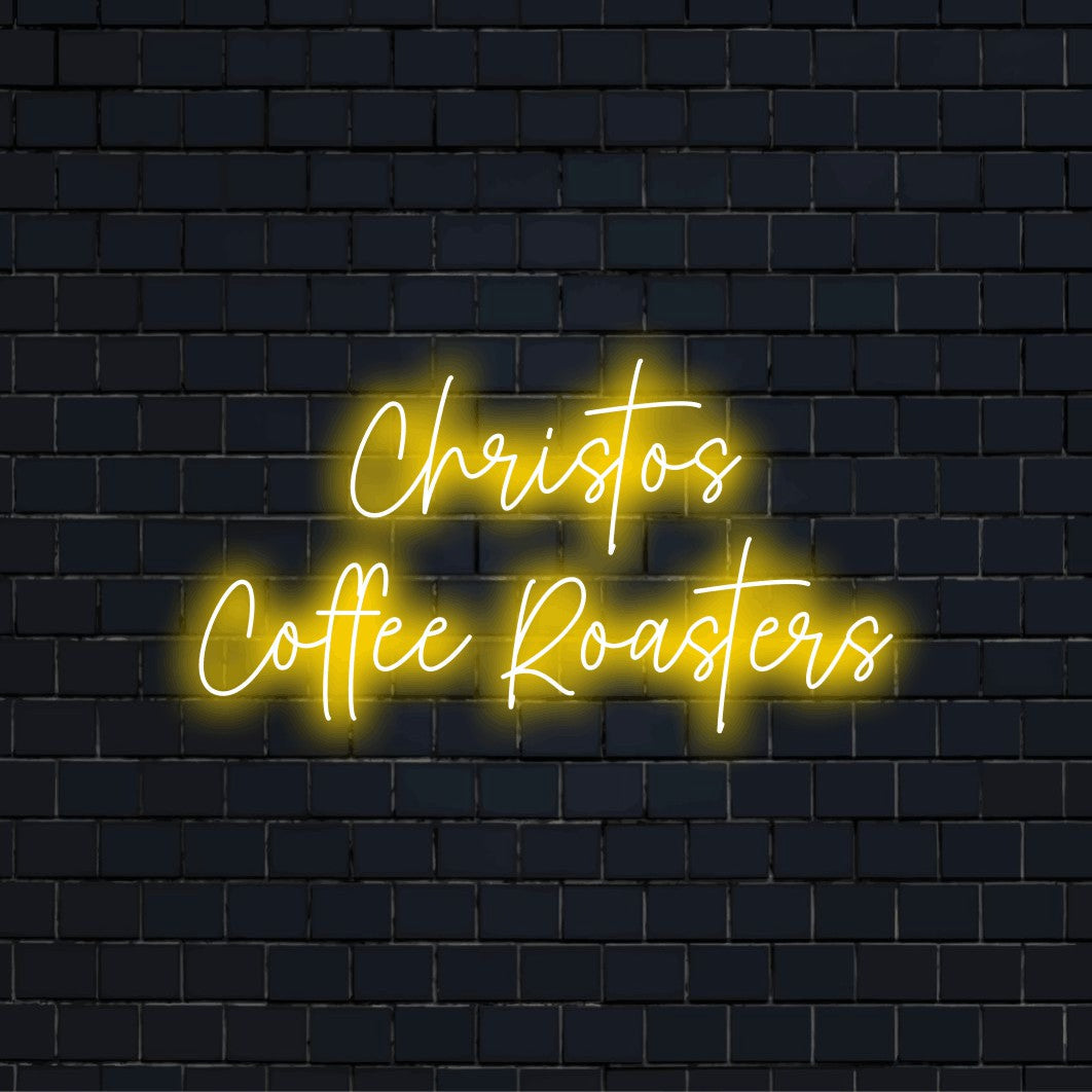 Christos Coffee Roasters Custom Name Neon Sign, bright neon lettering on dark brick wall