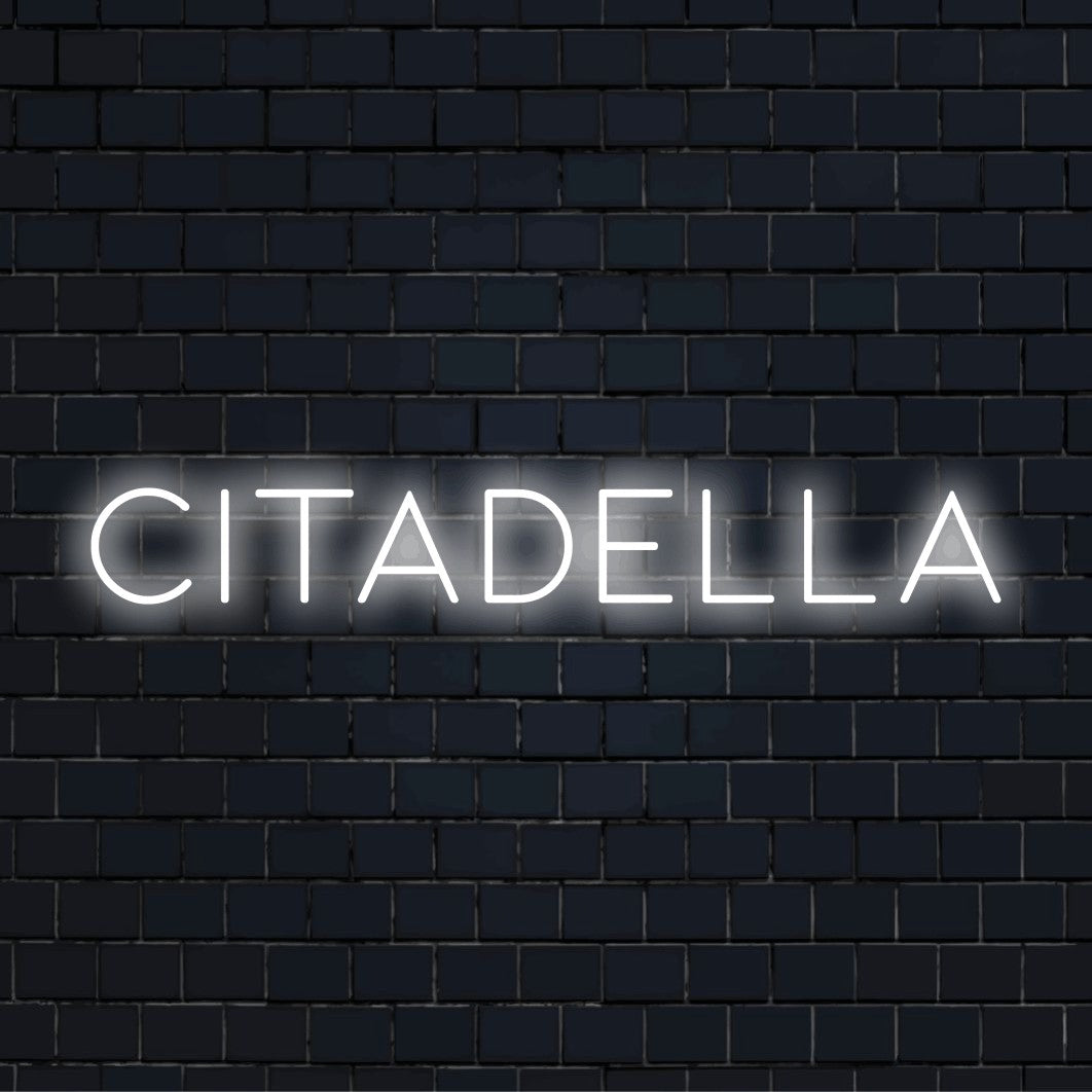 Citadella Neon Light with neon text light on black brick background