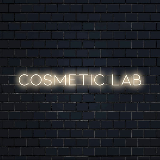 Cosmetic Lab Neon Sign, glowing lettering on black brick background