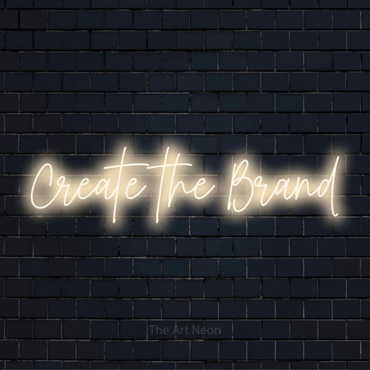 "Create The Brand" text design with neon effect on a black brick wall