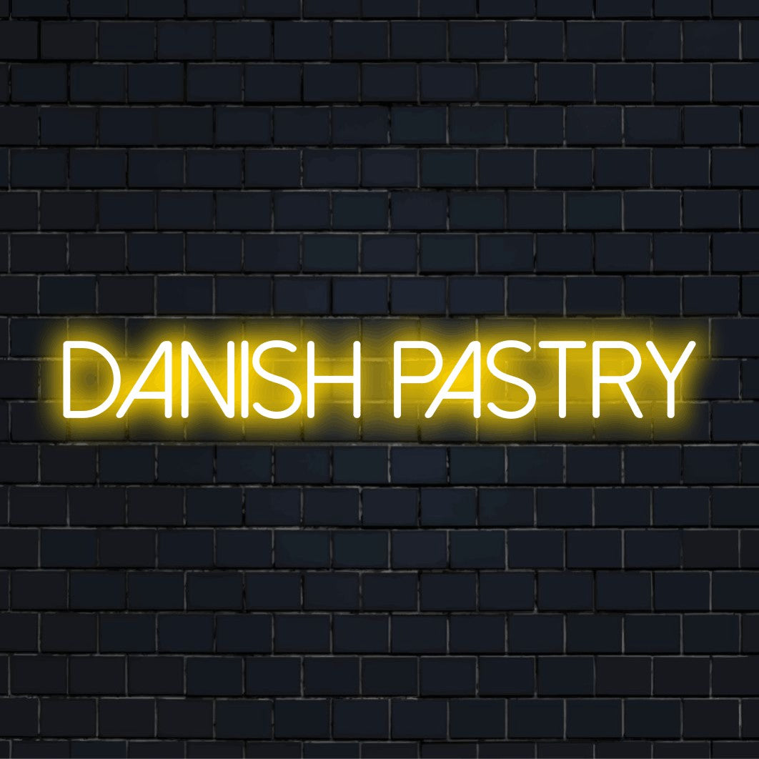 Danish Pastry Neon Sign, glowing lettering on dark brick background
