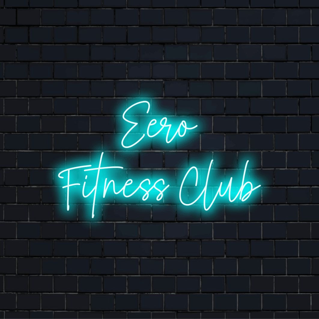 Eero Fitness Club Custom Name Neon Sign, glowing lettering against brick backdrop