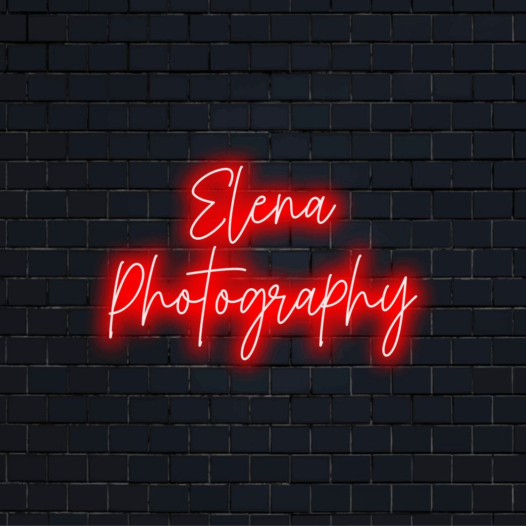 Elena Photography Custom Name Neon Sign, bright neon lettering on dark brick wall