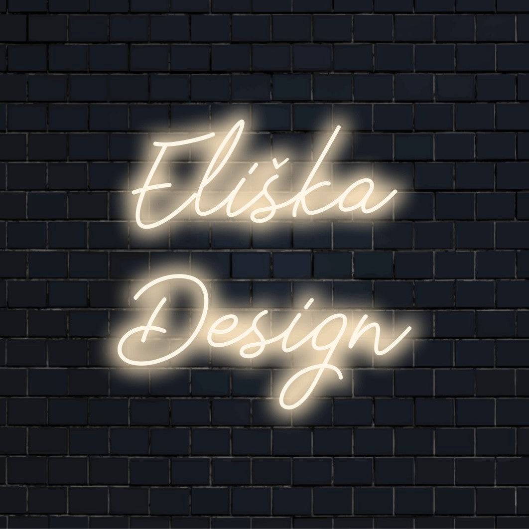 Eliska Design Custom Name Neon Sign, glowing lettering on dark brick wall