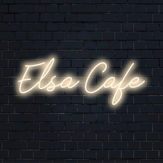 Elsa Cafe Custom Name Neon Sign, bright neon glow against brick backdrop