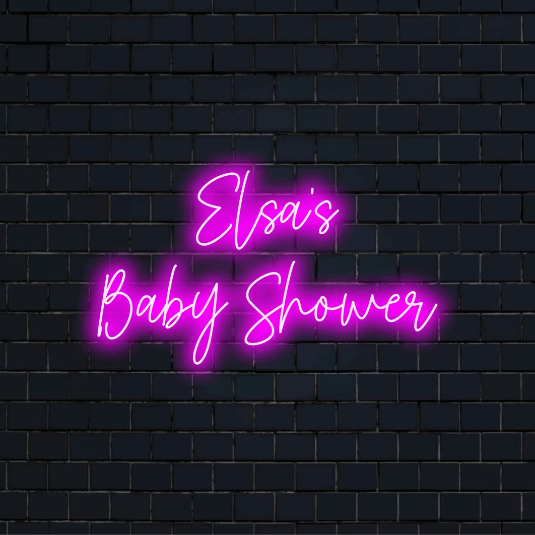 Elsa_s Baby Shower Personalized LED Neon Sign, neon text light on dark brick wall