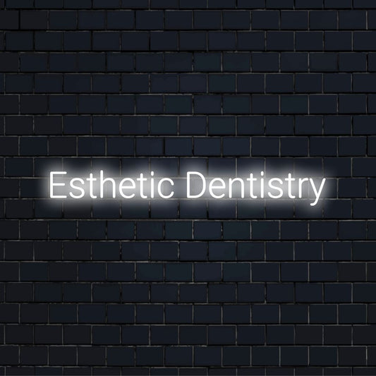 Esthetic Dentistry Neon Sign, bright neon lettering on dark brick wall