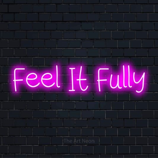 "Feel It Fully" neon text design on a black brick wall
