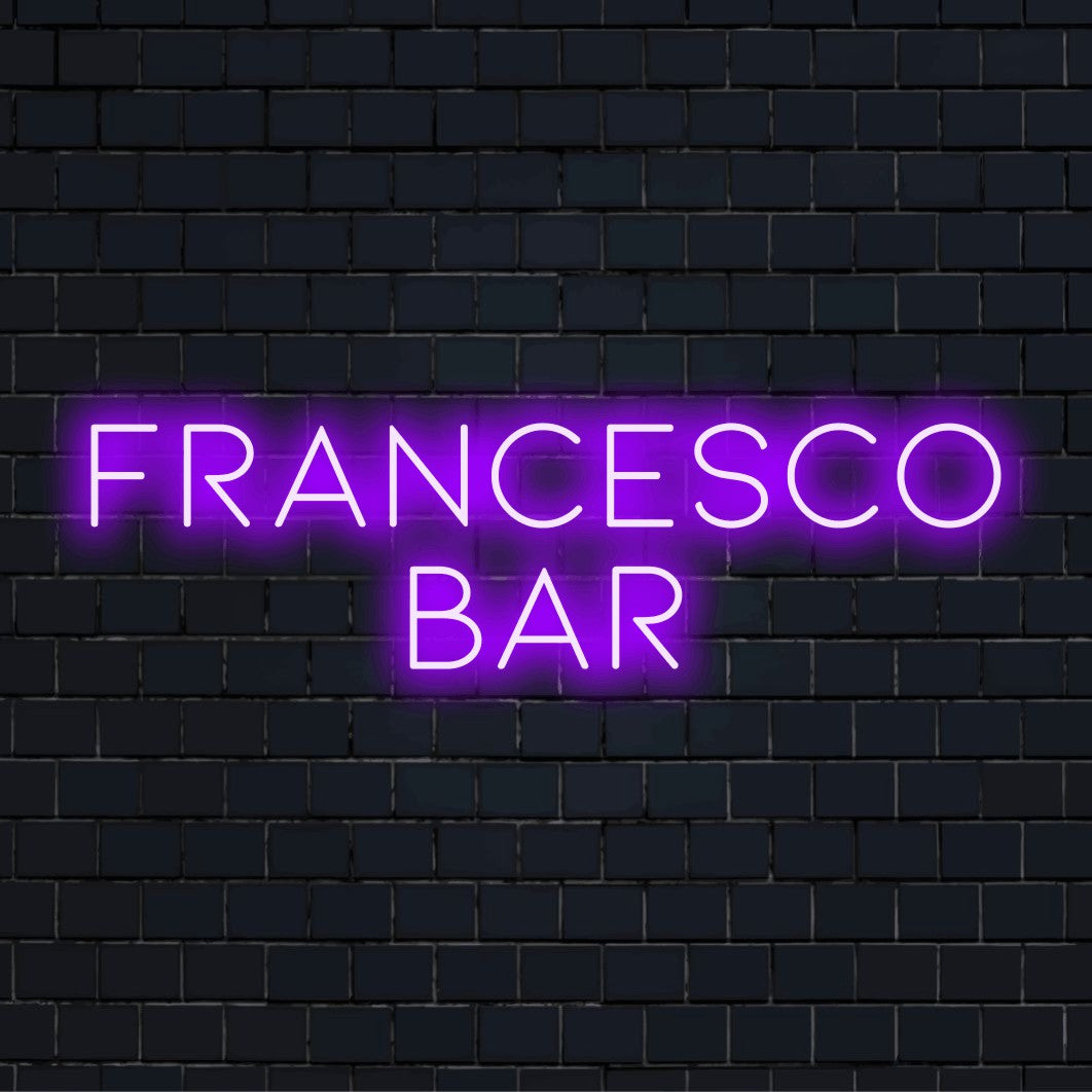 Francesco Bar Custom Name Neon Sign, bright neon lettering against black brick wall