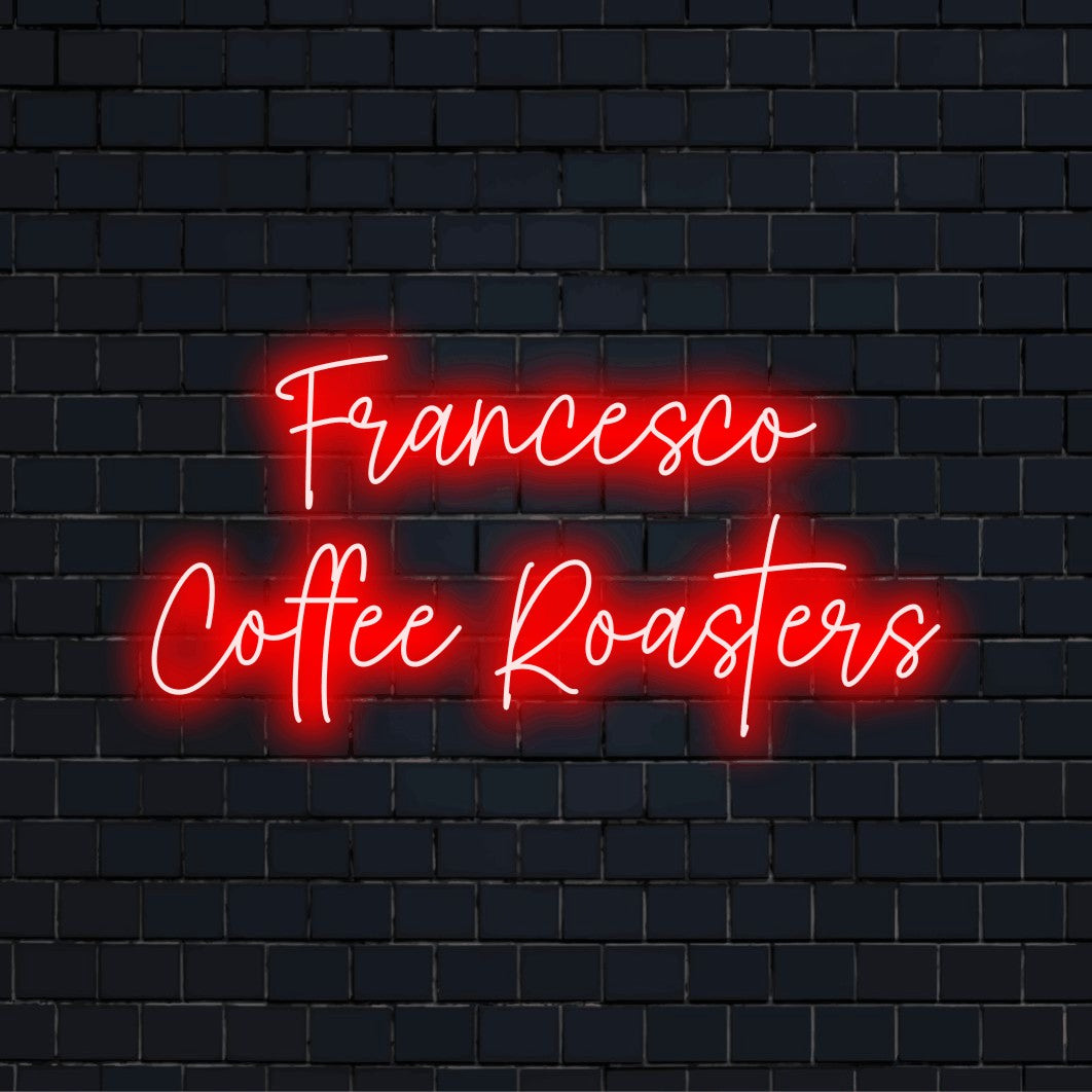 Francesco Coffee Roasters Personalized Neon Light with neon text light on black brick background