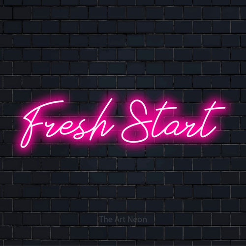 "Fresh Start" script-style LED neon sign on a black brick wall