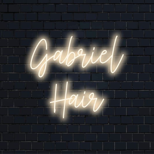 Gabriel Hair Custom Name Neon Sign, bright neon glow on dark brick wall