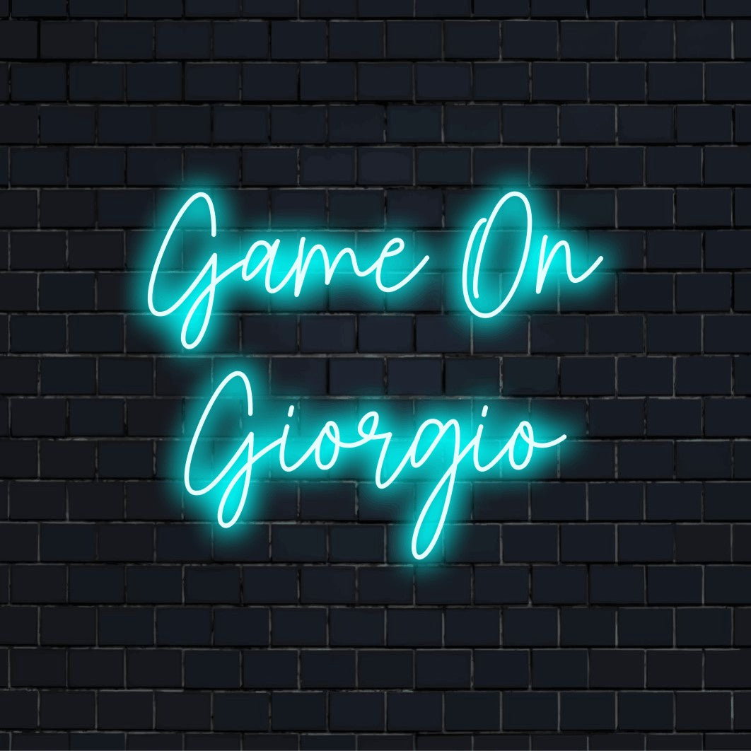 Game On Giorgio Custom Name Neon Sign, soft neon glow against black brick wall