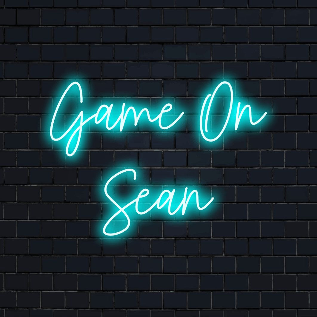 Game On Sean Custom Name Neon Sign, bright LED glow against black brick wall