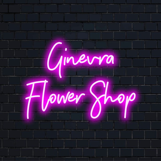 Ginevra Flower Shop Custom Name Neon Sign, glowing wall decor on dark brick wall