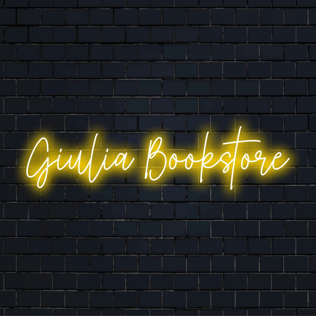 Giulia Bookstore Personalized Neon Light with bright LED glow against brick backdrop