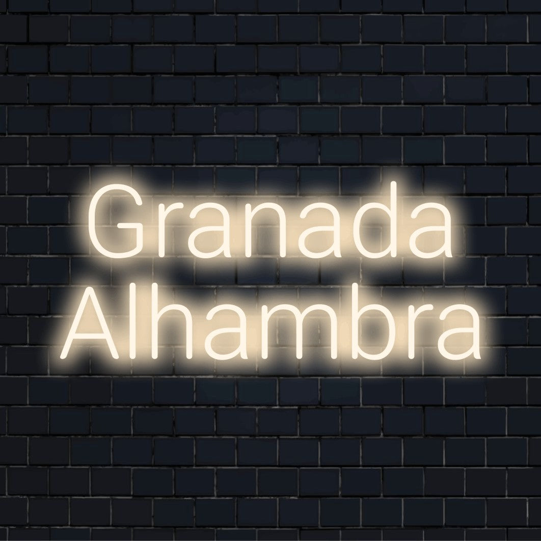 Granada Alhambra Neon Sign, glowing neon text against brick backdrop