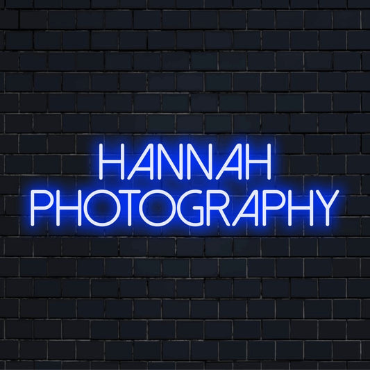 Hannah Photography Custom Name Neon Sign, bright LED glow against black brick wall