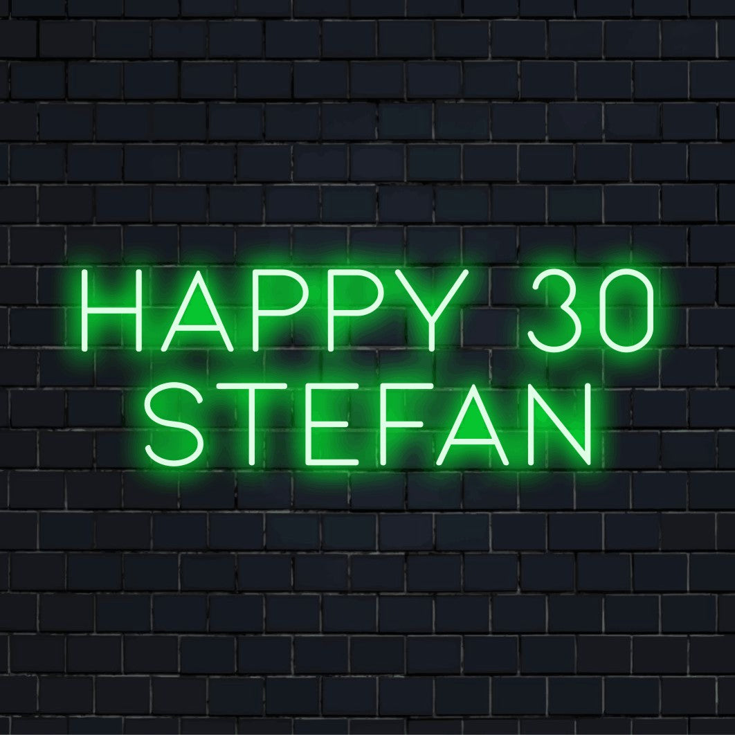 Happy 30 Stefan Custom Name Neon Sign, soft neon glow against black brick wall