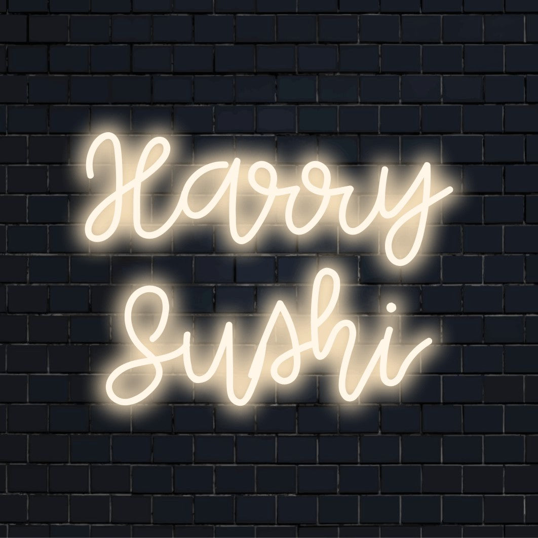 Harry Sushi Personalized Neon Light with bright neon lettering on dark brick wall