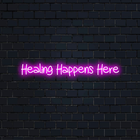 Healing Happens Here LED Neon Sign, neon text light against brick backdrop