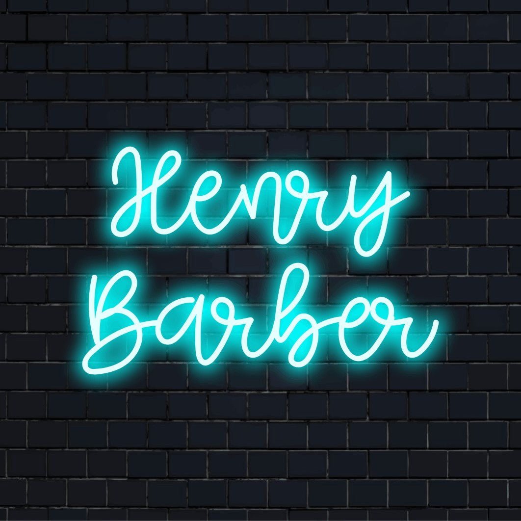 Henry Barber Custom Name Neon Sign, glowing wall decor on dark brick wall