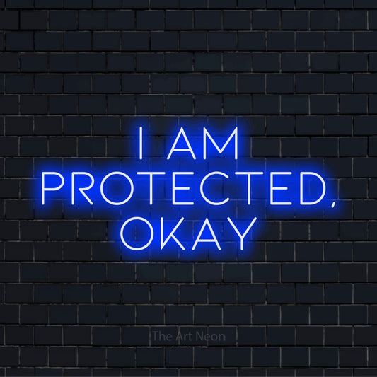 "I Am Protected, Okay" text design with neon effect on a black brick wall