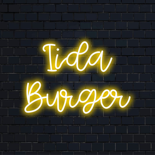 Iida Burger Custom Name Neon Sign, bright neon glow on dark brick wall