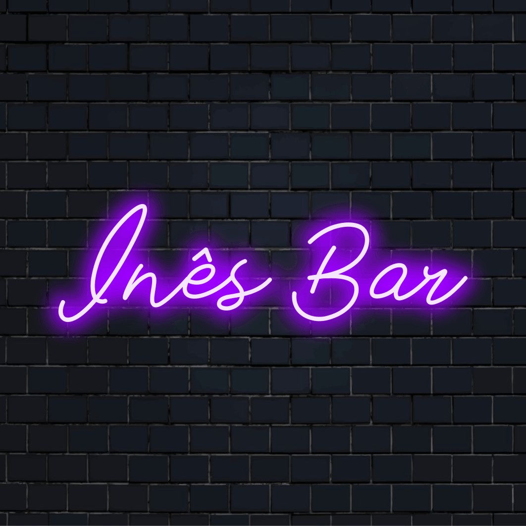 Ines Bar Custom Name Neon Sign, bright LED glow against black brick wall