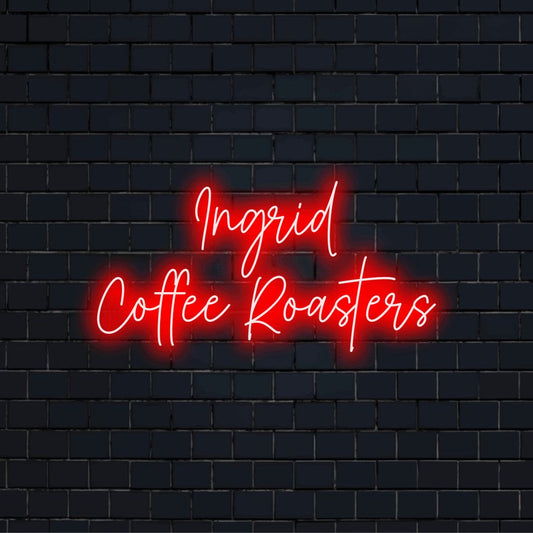 Ingrid Coffee Roasters Custom Name Neon Sign, glowing neon text against brick backdrop