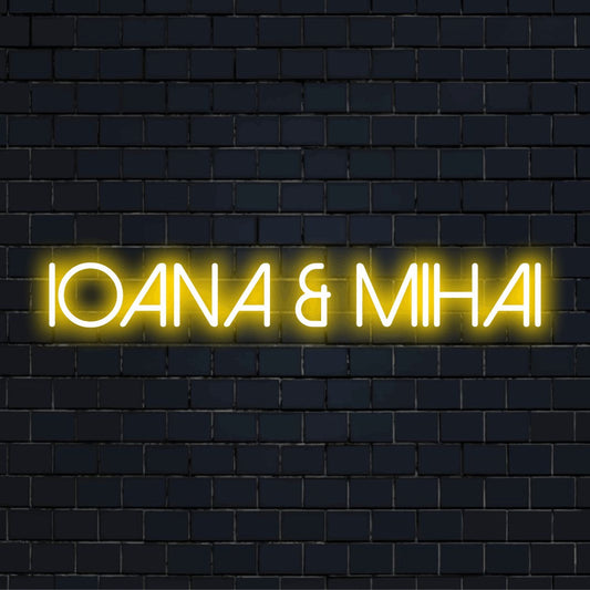 Ioana _ Mihai Custom Name Neon Sign, glowing lettering against brick backdrop