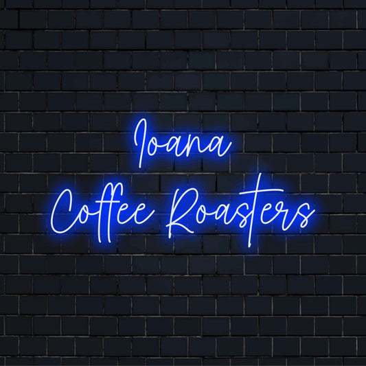 Ioana Coffee Roasters Personalized Neon Light with glowing wall decor against black brick wall
