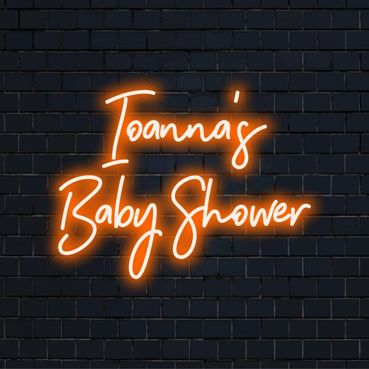 Ioanna_s Baby Shower Personalized Neon Light with glowing neon text on black brick background
