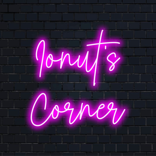 Ionut_s Corner Personalized Neon Light with glowing lettering on dark brick background