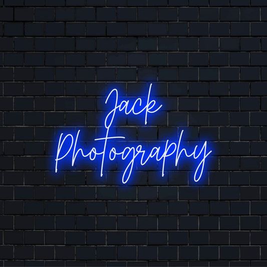 Jack Photography Custom Name Neon Sign, bright LED glow on black brick background