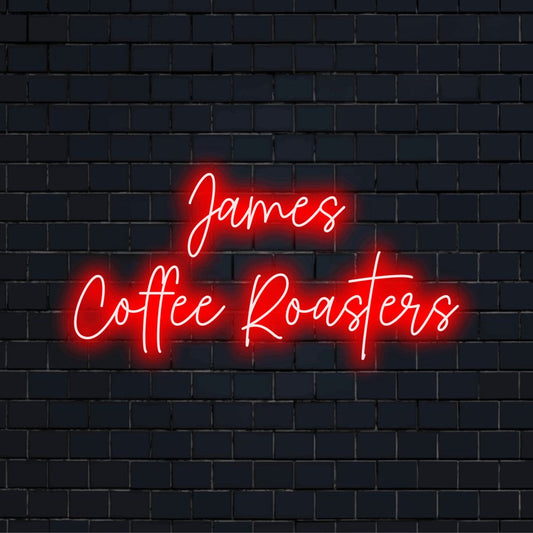 James Coffee Roasters Personalized Neon Light with neon text light against brick backdrop