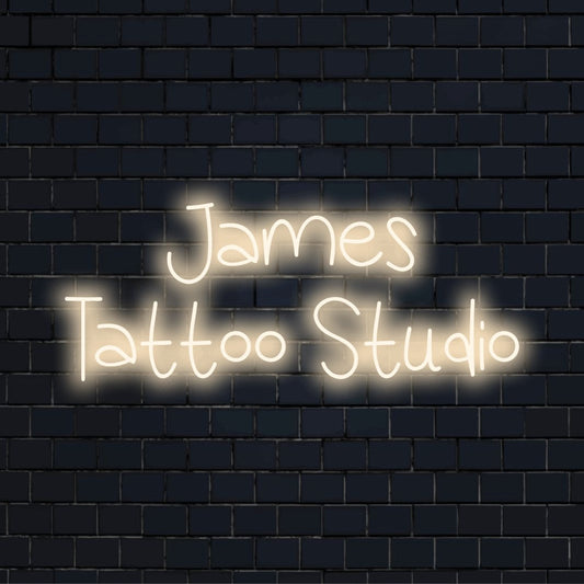 James Tattoo Studio Personalized LED Neon Sign, glowing wall decor on dark brick background