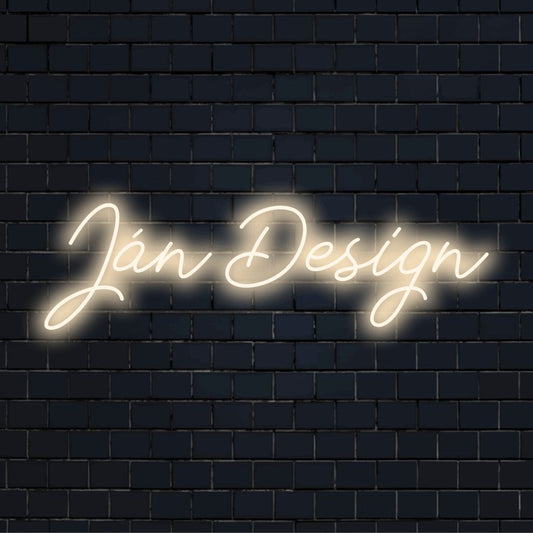 Jan Design Custom Name Neon Sign, glowing lettering against brick backdrop