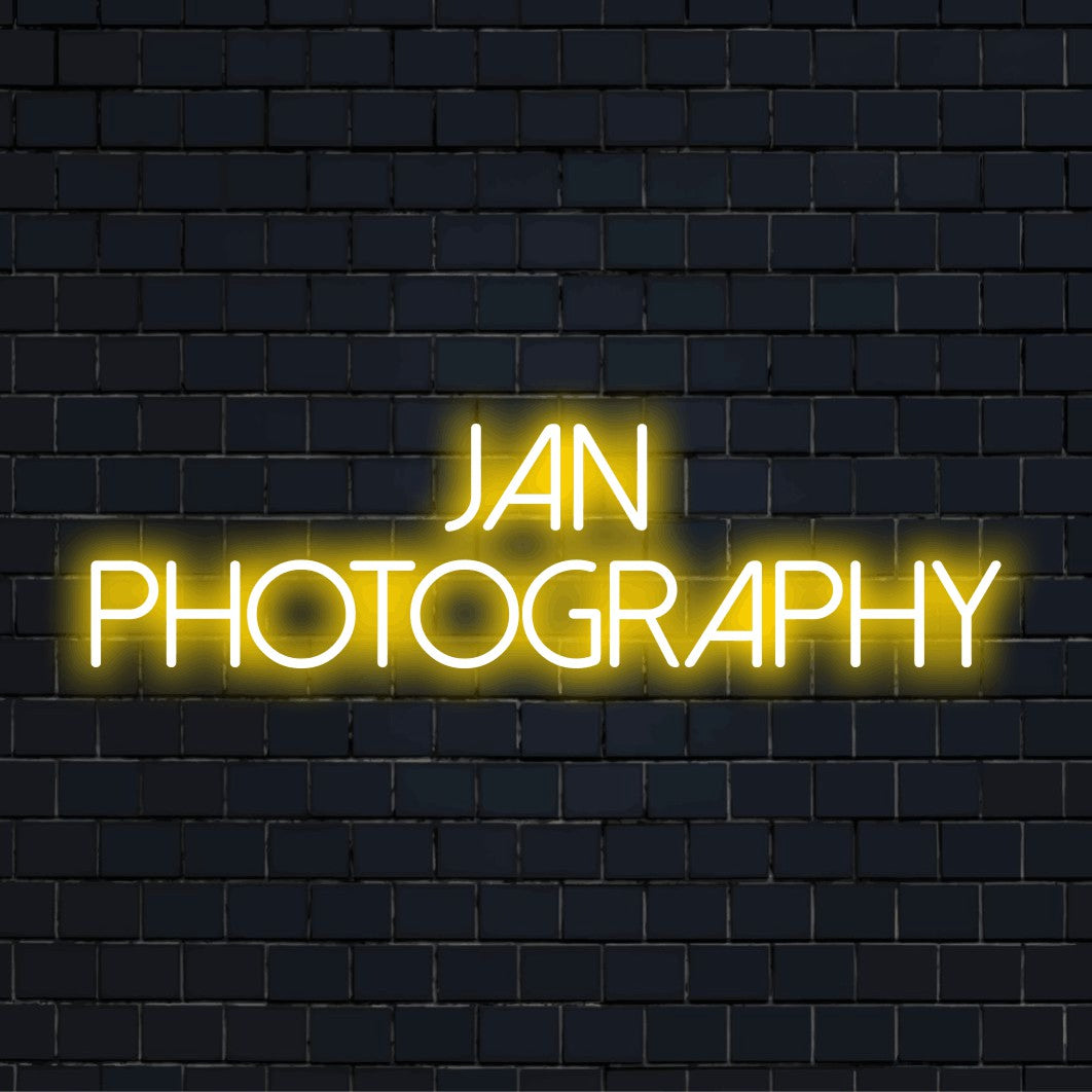 Jan Photography Personalized LED Neon Sign, soft neon glow on dark brick wall