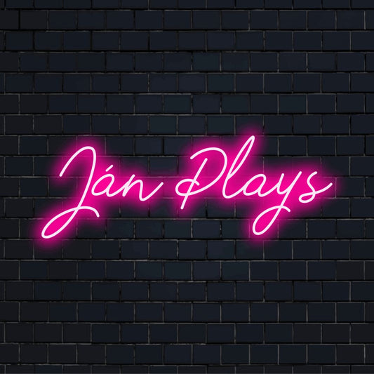 Jan Plays Custom Name Neon Sign, bright neon lettering on black brick background