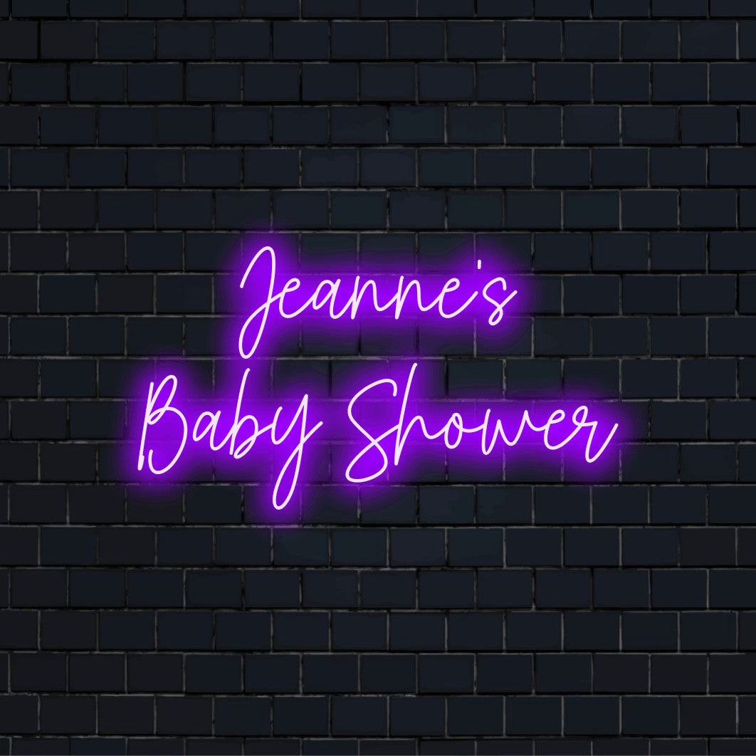 Jeanne_s Baby Shower Personalized LED Neon Sign, soft neon glow against black brick wall