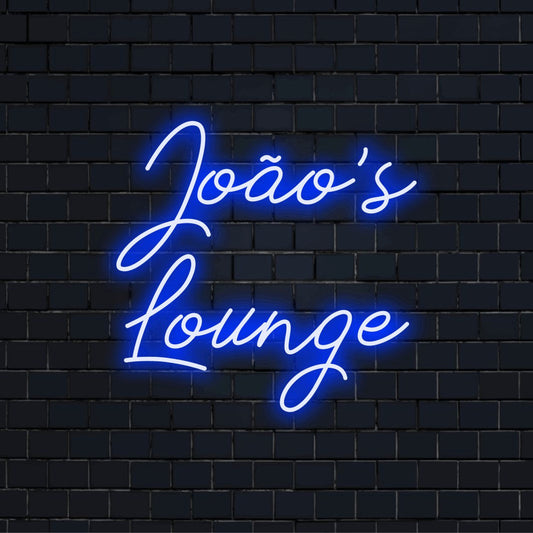 Joao_s Lounge Personalized LED Neon Sign, bright neon lettering against brick backdrop