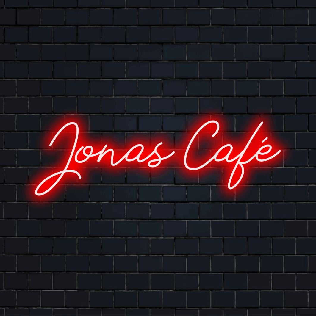 Jonas Cafe Personalized LED Neon Sign, soft neon glow against brick backdrop