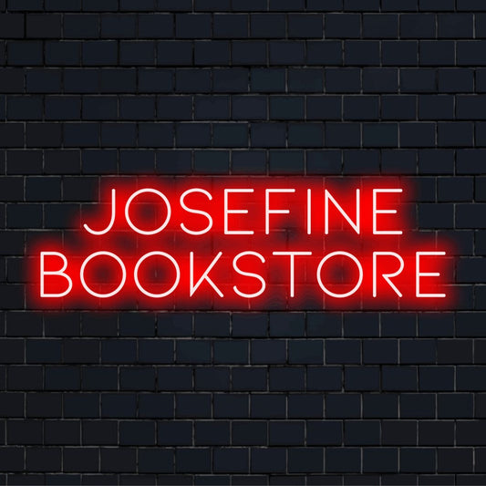 Josefine Bookstore Custom Name Neon Sign, glowing neon text on dark brick wall
